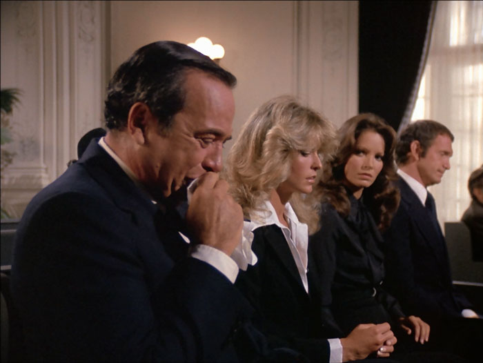 Bosley openly sobs at Sabrina's fake funeral, seated next to Jill, Kelly and Bill. Kelly gives him a strong look.