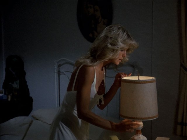 Jill turning off lamp.