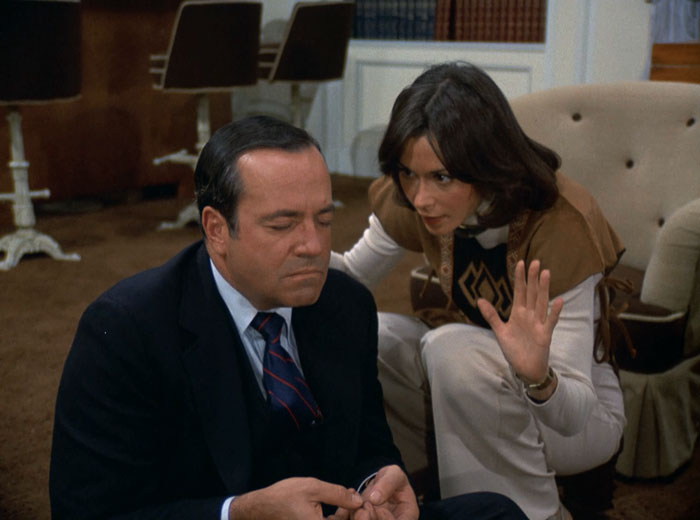 Sabrina (Kate Jackson) teaches Bosley (David Doyle) how to chant.